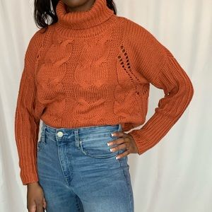 Burgundy textured turtleneck crop sweater.